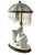 A charming continental figural table lamp, most likely Austrian, dating to circa 1920. The sculptural porcelain...