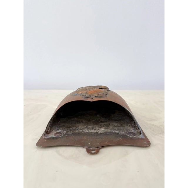 Striking vintage copper wall pocket with a raised profile of a classical warrior in elaborate armor and plumed helmet....