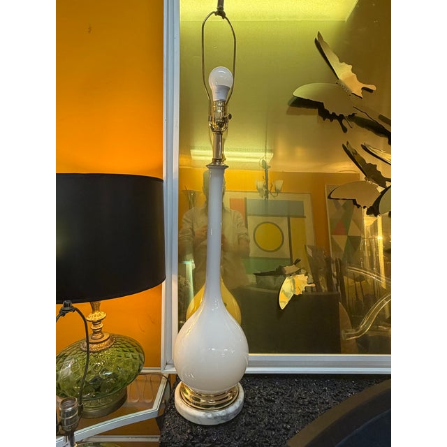 Hand blown Balboa white venetian lamp. White and grey marble base. Newly restored and re-wired and appointed with brass...