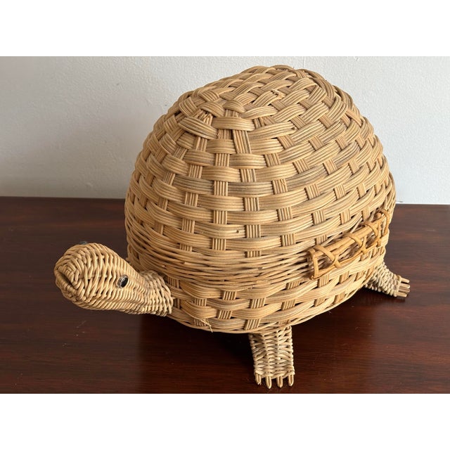 Delightful 1980s turtle shaped wicker basket with shell that opens for storage. Most items found at Pub & Oasis are...