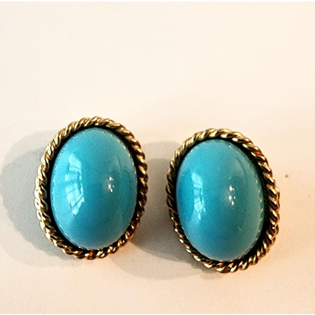 This timeless and sophisticated pair of 1970s Les Bernard Turquoise Cabochon and Gold Earrings will be a fabulous addition...
