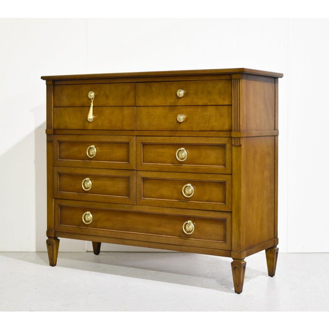 Timeless design and exceptional craftsmanship define this mid century bachelor's chest by Henredon Furniture. Featuring a...
