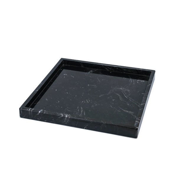 This square black Marquina marble tray is ideal for the spa, the bathroom, or as a centerpiece at any table. Each piece is...