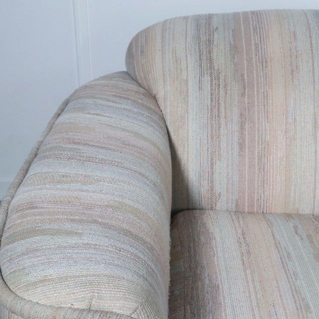 Modern and plush curved arm lounge chair by Carter. Original upholstery. Wonderful vintage condition with small mark to...