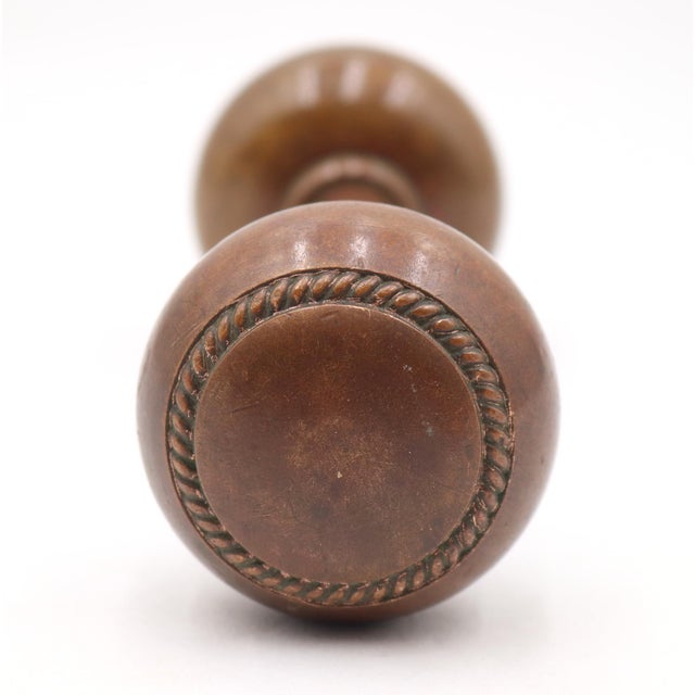 Vintage concentric rope design passage door knobs made of bronze with a patina finish. Good condition with surface wear...