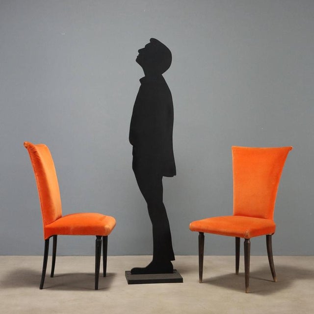 Eight style chairs from the 1980s featuring orange fabric upholstery, ideal for spaces requiring a distinctive design...