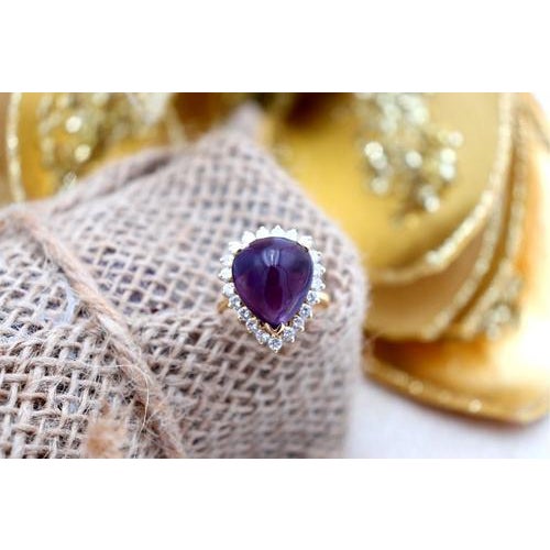 Heart-shaped gold ring with 8/8 brilliant-cut diamonds (21) and cabochon-shaped amethyst. Metal: Gold. Origin: Portuguese....