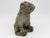 Strong and full of personality, this English 1970s era composite stone bulldog figure sits with a proud, slightly lifted...