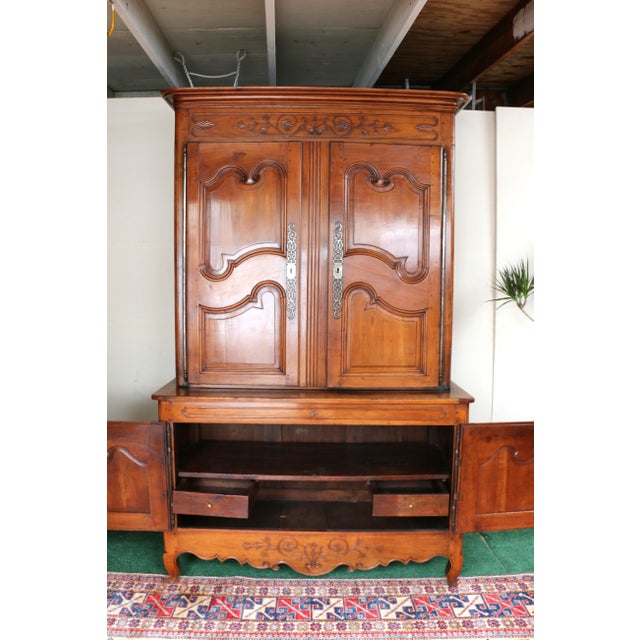 Spectacular 19th-century French buffet made of cherry wood. The buffet has two parts: a lower section with two doors and...