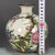 A beautiful Chinese porcelain vase featuring a creamy white Ge-type crackle glaze background. The vase is finely hand-...
