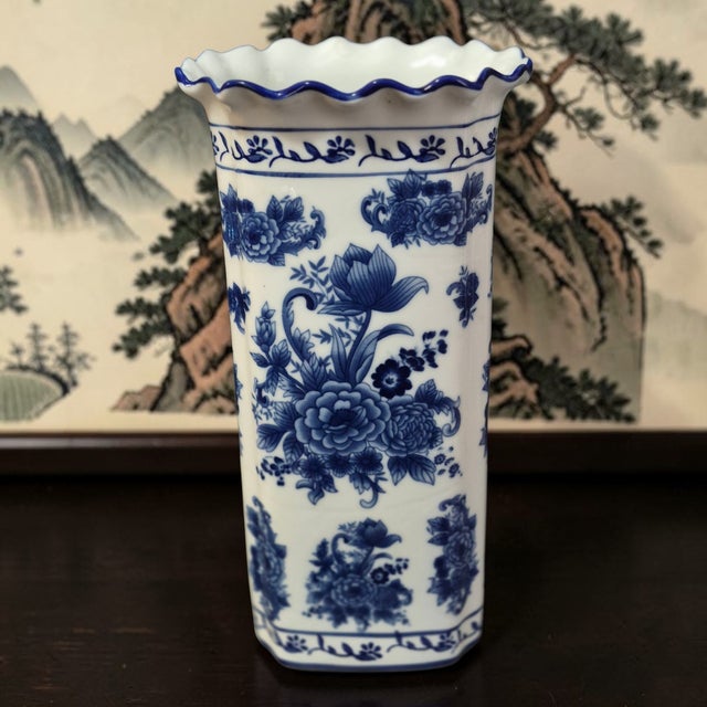 This vintage Asian Chinoiserie blue and white ruffled top floral vase is a stunning piece that captures the essence of...