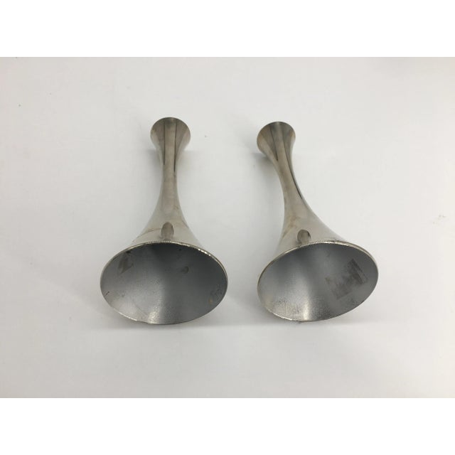 Set of retro MCM candleholders with the iconic curves that is typical to the era.