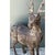 This pair of vintage carved wood deer sculptures commands attention with its near life-size scale and expressive,...
