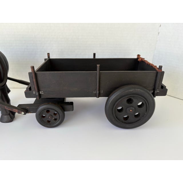 This striking vintage folk art sculpture features a hand-carved water buffalo (bull) pulling a wooden wagon cart, inspired...