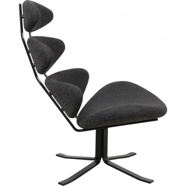 Erik Jørgensen Corna chair, from 2012, upholstered with grey Hallingdal fabric and with a frame of black steel. The chair...