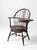 This early 20th-century Windsor writing armchair combines a sweeping bow back with an integrated writing desk and two...