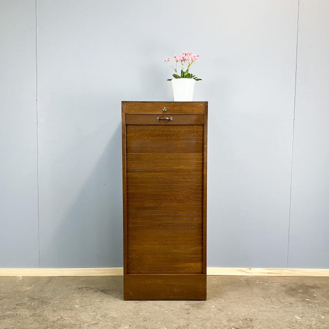 Nostalgic, cool, and practical to boot. This small cabinet with a rolling shutter is a true organizational powerhouse for...