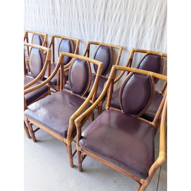 An effortlessly chic set that brings instant warmth and texture—these vintage rattan dining chairs in the style of McGuire...