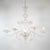 This handcrafted Cristallo Murano chandelier has five undulating scroll arms and features a bulbous center column with...
