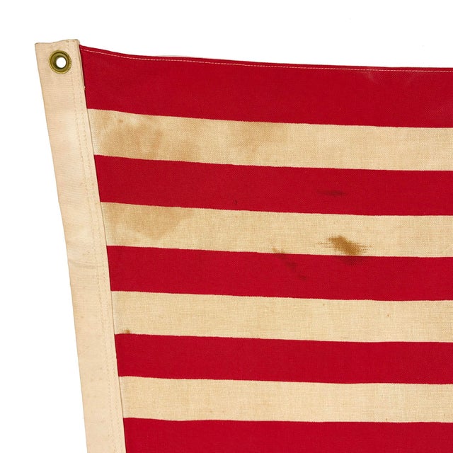 This vintage Easton flag is made from a thin cotton cloth. Printed design is visible on both sides with lighter coloring...
