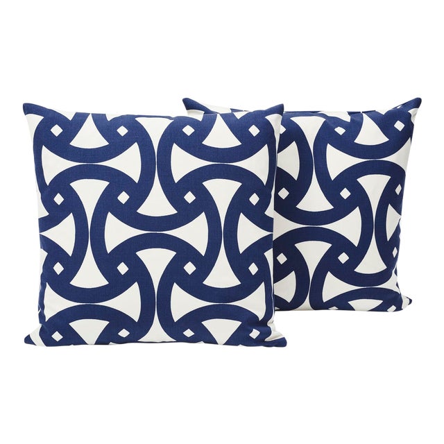 This marine blue geometric print, filled with interlocking curves, has a bold flair sure to heighten any setting! Made...