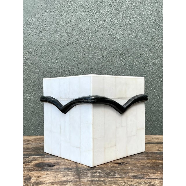 This vintage black and white stone box pairs a crisp geometric palette with richly tactile craftsmanship. Its wood body is...