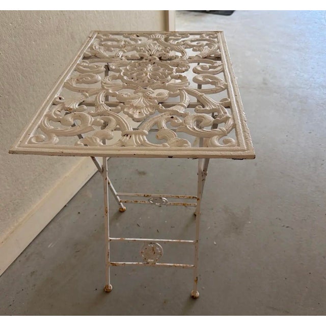 Shabby chic metal folding table. Folds fine.