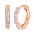Discover pure elegance and refined allure with these 10K rose gold huggie hoop earrings, a stunning testament to both...