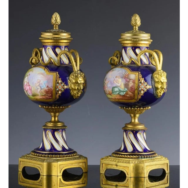 French Serves-style Porcelain & Gilt Bronze Ormolu Cassolettes Urns, Circa 1880-1900 The French porcelain ormolu bronze...