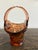 This is a vintage Tiara Indiana Glass "Empress Bird of Paradise" basket in an amber or peach hue, featuring a distinctive...