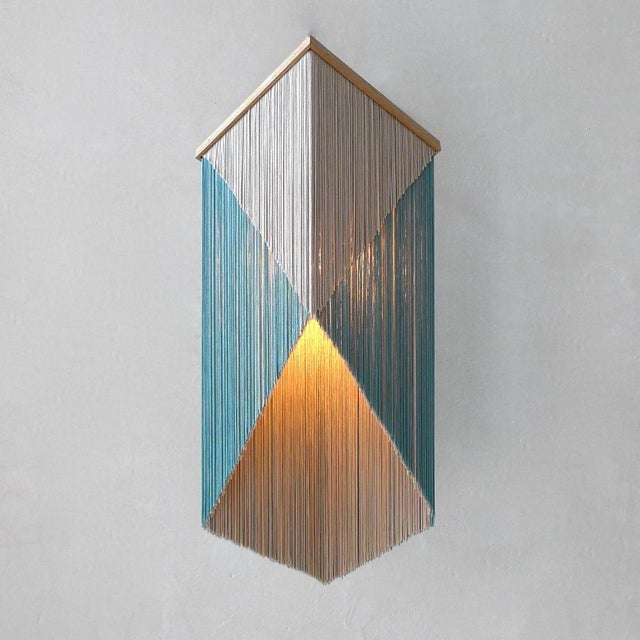 No. 28 wall lamp by sander bottinga dimensions: h 46 - 70 x w 31 x d 22 - 30 cm materials: brass, wood, leather, viscose...