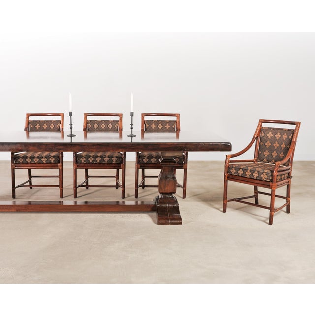 A handsome rustic country Italian oak farmhouse trestle dining table in the Provincial style. The table is crafted on a...