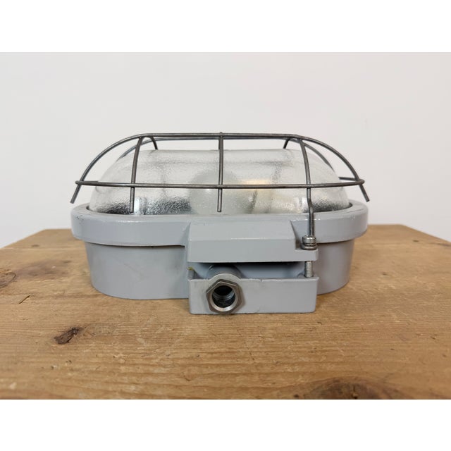 This industrial wall light was made by Elektrosvit in former Czechoslovakia during the 1970s. It features a cast aluminium...