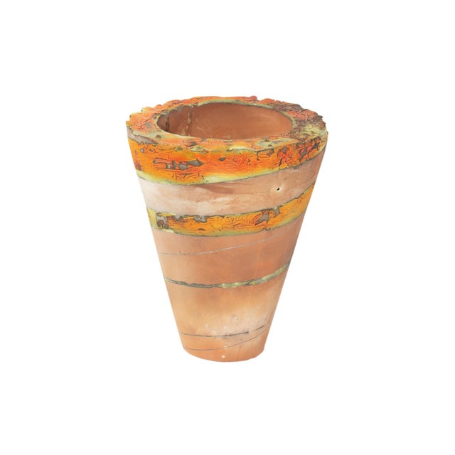 A studio pottery vase by the American artist Bob Shay (born 1944). This cone-shaped vase features layers of earth toned...