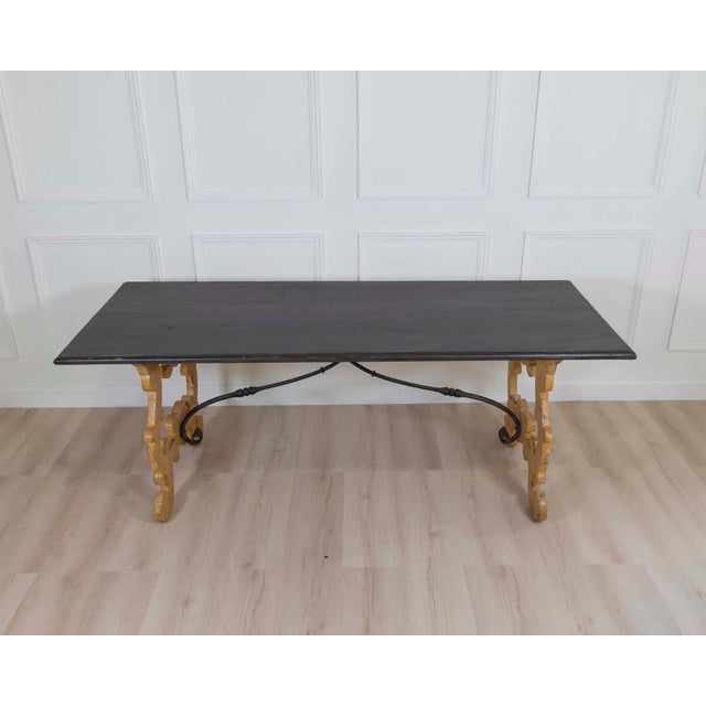 A striking large Italian lyre table, distinguished by its sculptural form, generous scale, and beautifully aged lacquered...