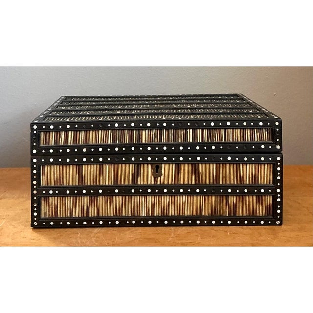 Exemplifying skillful material blending and meticulous craftsmanship, this vintage quill and inlay box is masterfully...