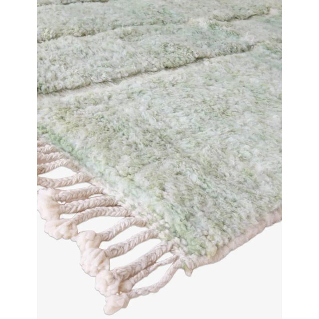 Add a natural touch to your home with our Middle Atlas rug. Measuring 11.3 by 8.3 feet, this rug features a subtle...