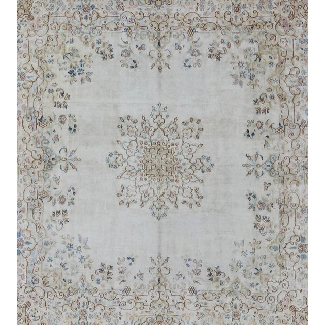 Measures: 6'10 x 7'1. Antique Persian Kerman Rug Featuring Central Medallion and Delicate Botanical Motifs 6′10″ × 7′1″....