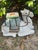 A striking ceramic garden stool sculpted in the form of a resting camel, richly decorated with hand-painted floral and...