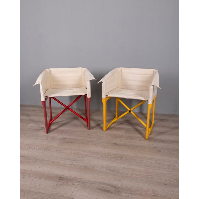 Pair of folding chairs with yellow and red plastic frame, white fabric upholstery, model 4820, designed by Masayuki...