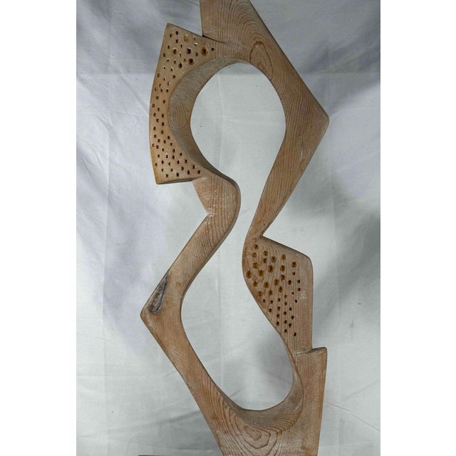 Carved pine abstract figural sculpture titled "Thin Figure" created in 1965 by Herbert Simon. Signed by the artist. A rare...