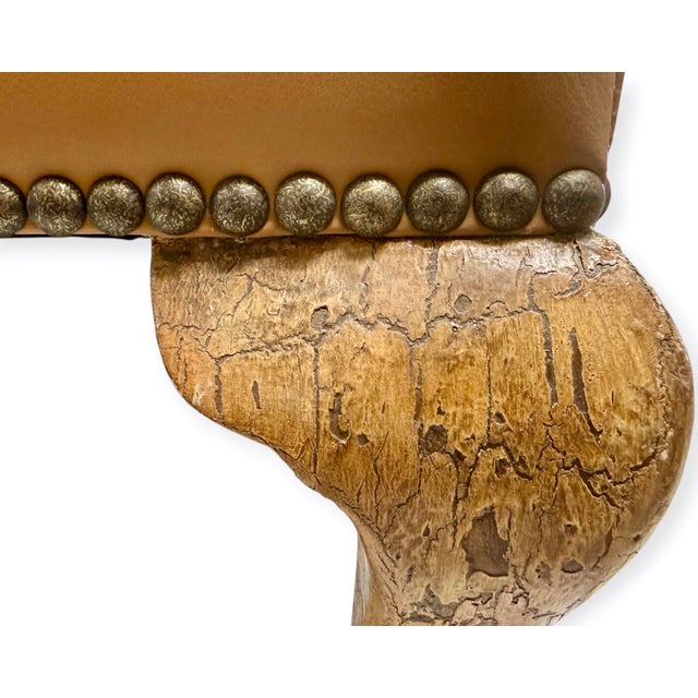 Custom leather ottoman upholstered by world-renowned Danny Cannon Custom Upholstery, Inc. in warm camel-toned leather....