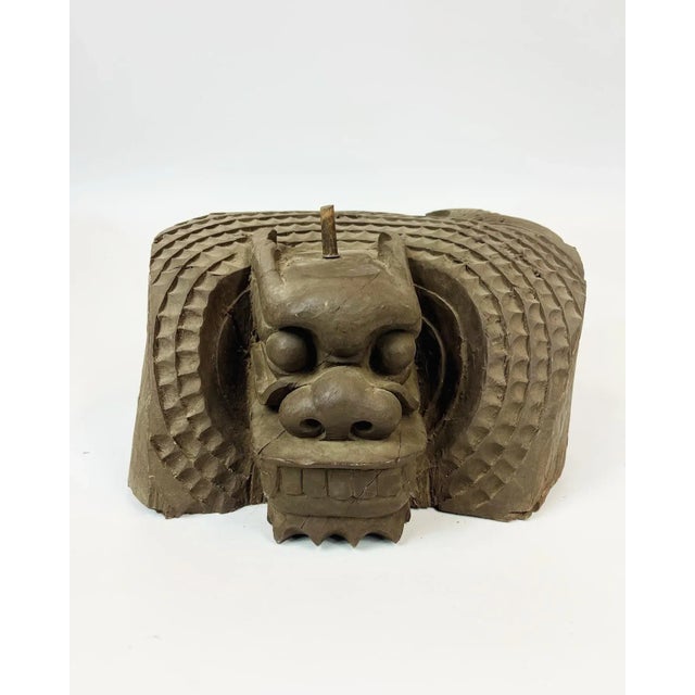This majestic and calm dragon is carved from a single block of wood. It was likely used as an architectural item. There is...