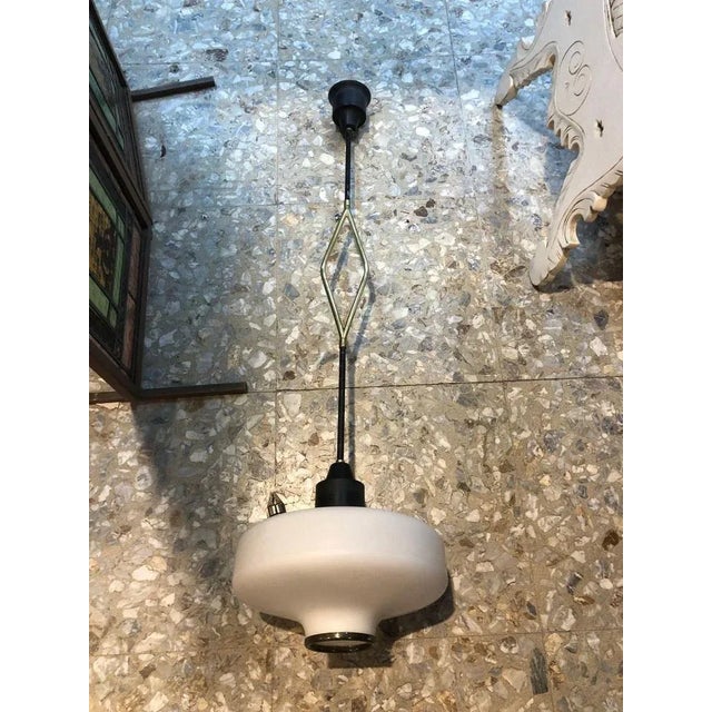 Amazing, stilnovo style chandelier space age brass and opaline glass, 1970 italy. Good condition, original patina, runs at...