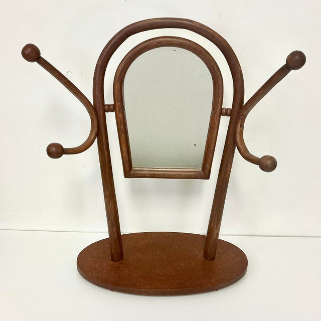 From our private collection. This is a vintage Italian Bentwood Sticks and Ball tabletop mirror with two double hook hat...