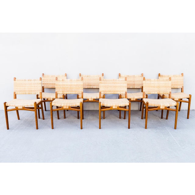 A museum quality set of twelve CH 31 dining chairs in oak by Hans Wegner, made in Denmark by Carl Hansen & Son c. 1950s....