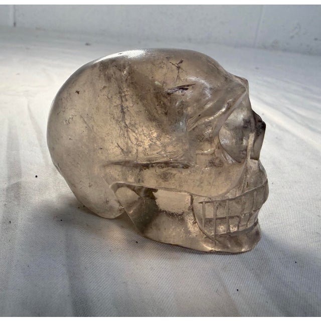 Up for sale is an exquisite antique hand-carved rock crystal skull sculpture. This highly detailed sculpture features...