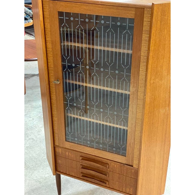 Danish Modern Corner Cabinet or Bar with glass doors. Shelves are not adjustable. 35w 22.5d 57.5h