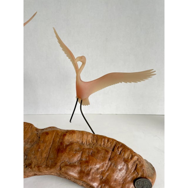 Here is a beautiful sculpture made/designed by John Perry in the early 1980's. The piece features two pink flamingos, with...