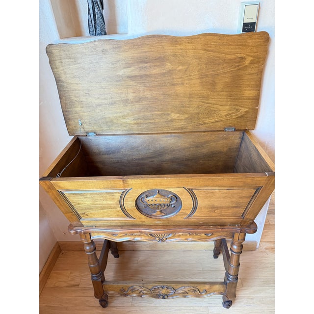 A statement French Provincial dough bin console, known in France as a pétrin or maie, dressed in warm walnut veneer and...
